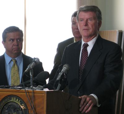 Idaho Gov. Butch Otter announces budget cuts Friday, as  Superintendent of Schools Tom Luna, left, and House Assistant Majority Leader Scott Bedke, R-Oakley, look on. (Betsy Russell / The Spokesman-Review)