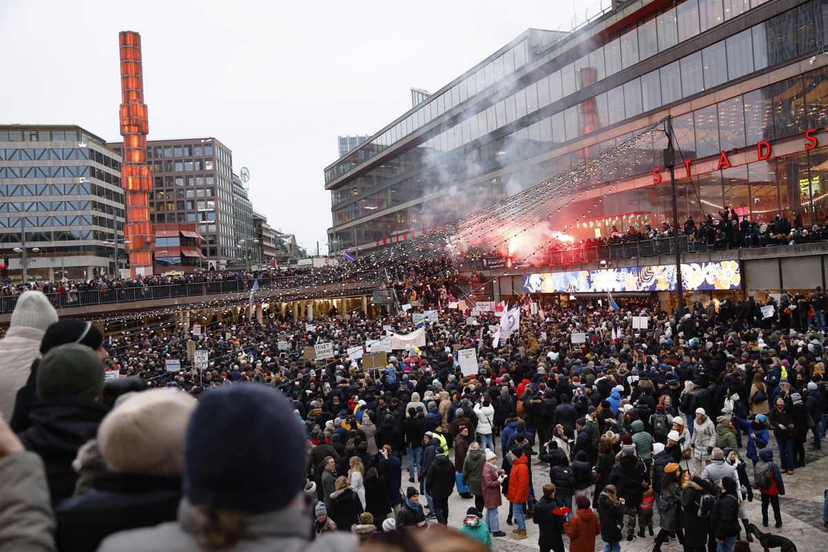 Protestors gather to demonstrate against the coronavirus measures including the vaccine pass, in Stockholm, Sweden, Saturday, Jan. 22, 2022.  (Fredrik Persson)