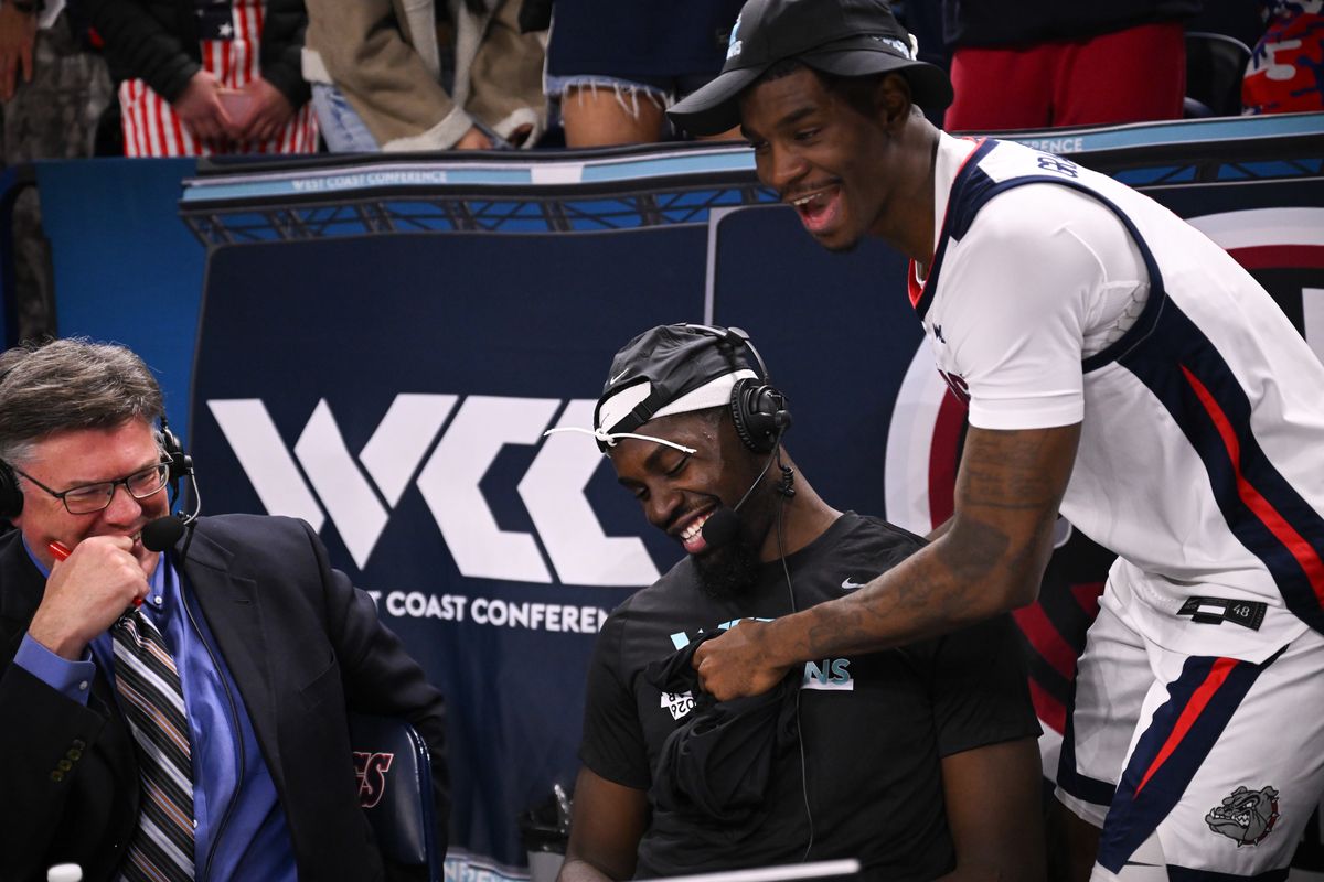 Tyon Grant-Foster, right, hugs teammate Graham Ike after Gonzaga defeated Portland on Wednesday at McCarthey Athletic Center.  (Tyler Tjomsland / The Spokesman-Review)
