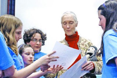 
Students show Jane Goodall letters and pictures they created for her during the 