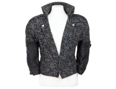 This image released by Profiles in History shows a black and white blazer with leather sleeves, worn by Prince in the 1984 film, “Purple Rain.” (Charlie Nunn / Associated Press)