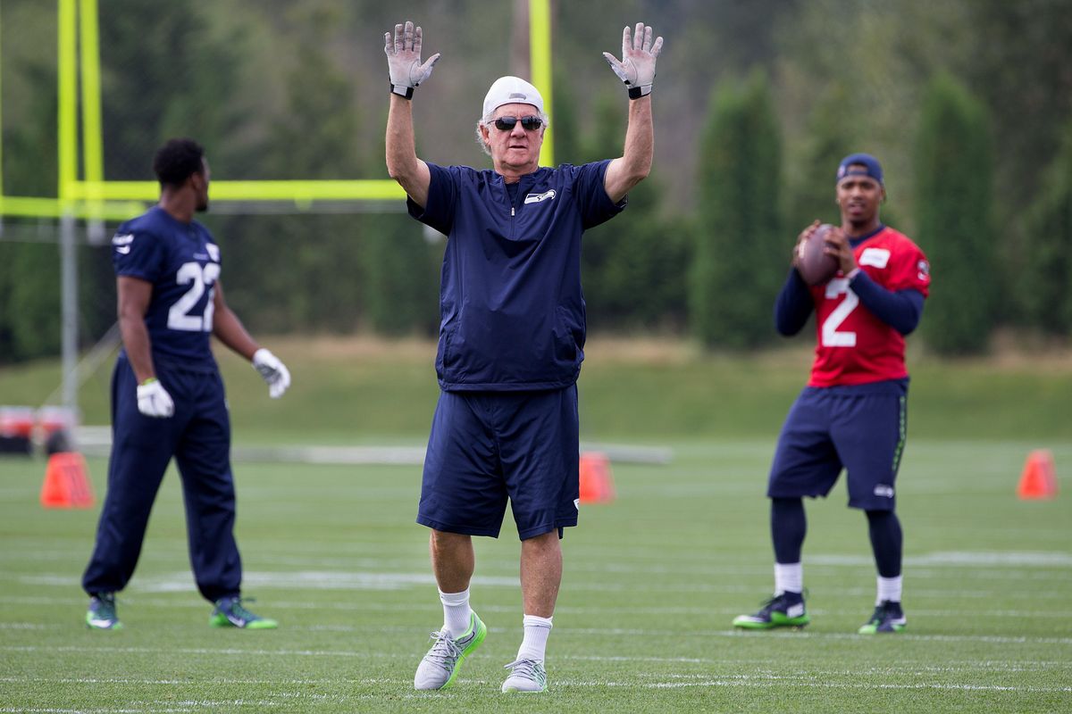 Seattle Seahawks quarterbacks coach Carl Smith, center, monitors his unit as quarterback Trevone Boykin, right, looks to pass during training camp on Tuesday, August 16, 2016, in Renton. (Johnny Andrews / The Seattle Times)