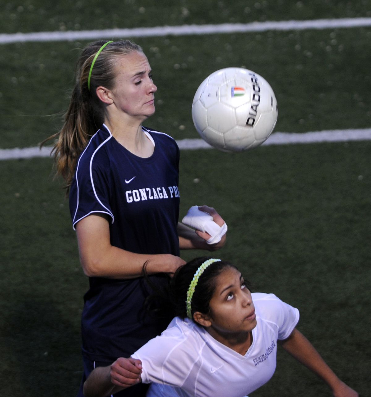 Gonzaga Prep’s Colleen Lindsay, top, and Central Valley’s Jasmine Ayala battle for the ball on Tuesday at Joe Albi Stadium. (Jesse Tinsley)