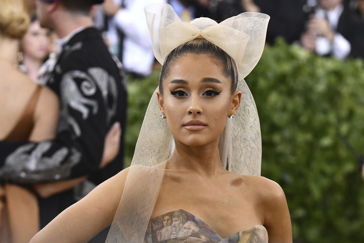 In this Monday, May 7, 2018 file photo, Ariana Grande attends the Metropolitan Museum of Art’s Costume Institute benefit gala celebrating the opening of the “Heavenly Bodies: Fashion and the Catholic Imagination” exhibition. (Charles Sykes / Invision/Associated Press)