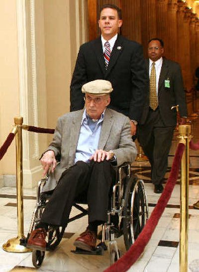 
Chief Justice William Rehnquist is pushed in a wheelchair on Capitol Hill in this May 23, 2005, file photo after his visit to the Capitol Medical Department.  
 (Associated Press / The Spokesman-Review)