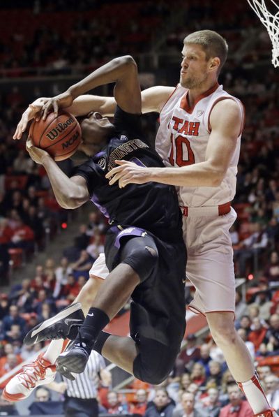 Utah's Renan Lenz (10) fouls UW's Mike Anderson as he heads to the basket. (Associated Press)