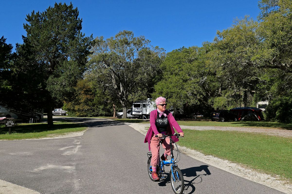 Leslie Kelly rides her new folding bike in Huntington Beach State Park in South Carolina.   (John Nelson)