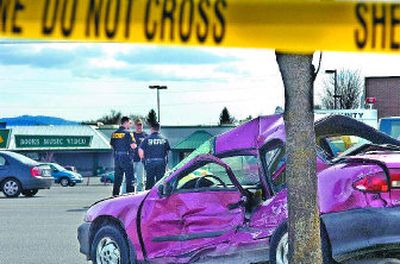 
A small Chevy was broadsided by a large pickup on Sprague just west of Sullivan on Thursday in Spokane Valley. The car was apparently stopped in a westbound lane while trying to enter the center turning lane, where it was hit by the truck around 1 p.m.  
 (Christopher Anderson / The Spokesman-Review)
