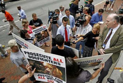 
Mike Brazell, of People for the Ethical Treatment of Animals (PETA), talks to reporters about Michael Vick outside the U.S. courthouse in Richmond, Va., on Monday. Associated Press
 (Associated Press / The Spokesman-Review)