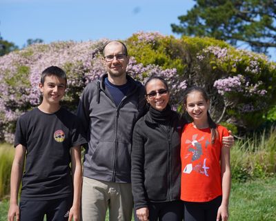 Sava Iliev, 15, Rado Iliev, 42, Ellie Pojarska, 44, and Raya Iliev, 11, stand at the end of their street where they start all their walks as a family in Belmont, California.  (Assad Rajani)