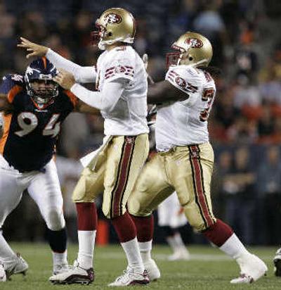 
Niners' offensive lineman Thomas Herrion, right, blocks for QB Cody Pickett on Saturday.
 (Associated Press / The Spokesman-Review)
