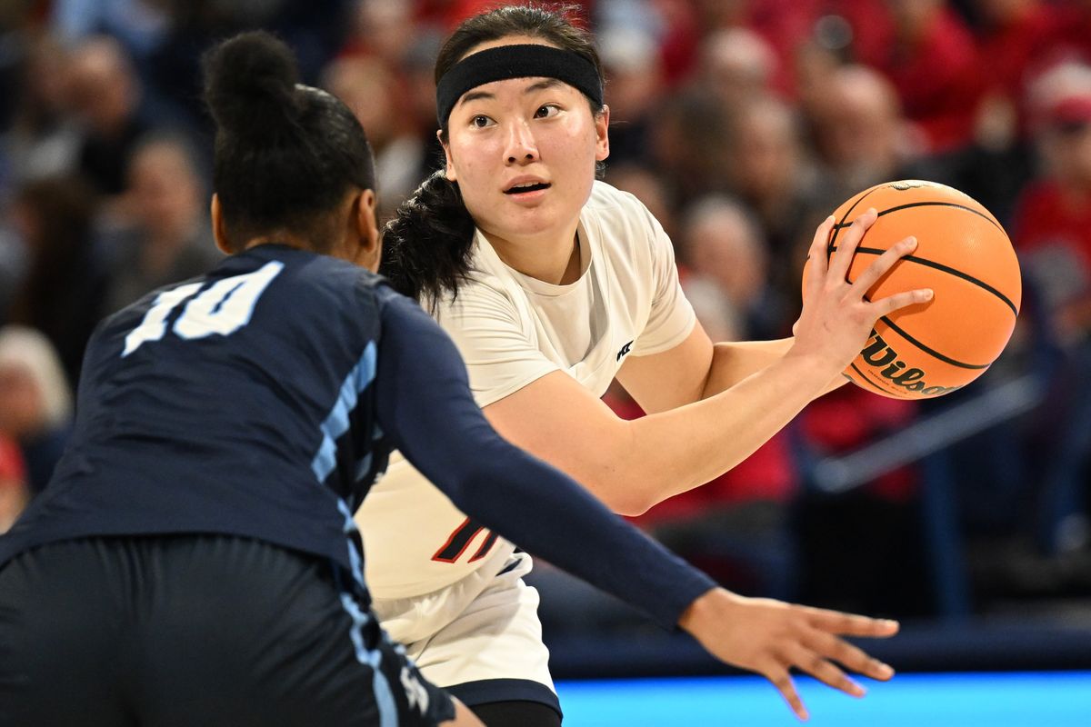 Gonzaga’s Kayleigh Truong looks to pass against San Diego’s Dylan Horton during West Coast Conference play Jan. 13 at McCarthey Athletic Center.  (TYLER TJOMSLAND/THE SPOKESMAN-REVIEW)
