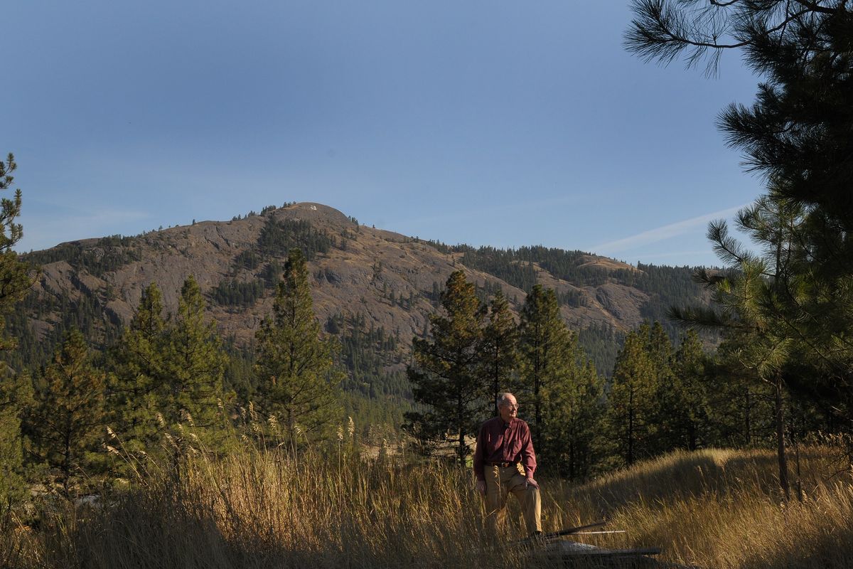 Dick Slagle stands in front of Gibralter Mountian outside Republic, Wash. Tuesday September 16, 2008. ” I’ve lived under that mountian so long it’s like a member of the family” said Slagle. Slagle carried photos of the local mountains throughout World War ll and used the beauty of the mountains to carry him through the tough times of the war.  (CHRISTOPHER ANDERSON)