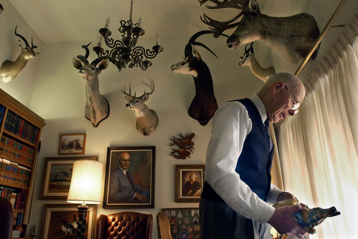 In his study at home Dr. Ralph Berg holds a clay model of the human heart. He pioneered open heart and heart transplant medicine in Spokane 50 years ago. He was the first heart surgeon and developed many of the present day practices performed in local hospitals. He also has an avid interest in hunting as witnessed by some of the mounted trophy above him. Christopher Anderson/the Spokesman-Review  (SR)