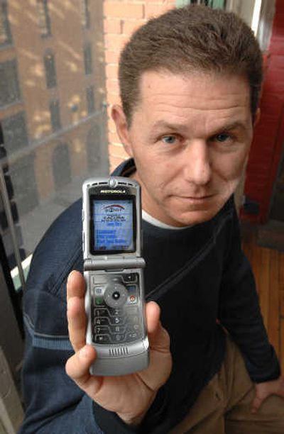 
Rob Adler, CEO of go2 Media holds a cell phone displaying an example of the company's efforts to deliver advertising and content targeted to the interest and location of the user at go2 Media's office in Boston.Associated Press
 (Associated Press / The Spokesman-Review)