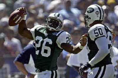 
New York Jets cornerback Erik Coleman does a dance for teammate Eric Barton after his first quarter interception against the San Diego Chargers Sunday.
 (Associated Press / The Spokesman-Review)