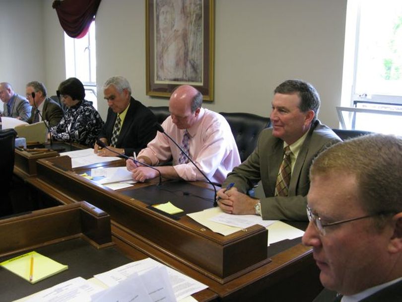 House Ways & Means Committee members, including, from right, Reps. Ken Roberts, R-Donnelly, Scott Bedke, R-Oakley, and Mike Moyle, R-Star, consider legislation Thursday morning creating two task forces to work on transportation funding issues after lawmakers leave town this year. (Betsy Russell / The Spokesman-Review)