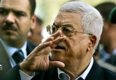 
Palestinian Authority President Mahmoud Abbas gestures as he leaves the terminal at the border between Rafah and Egypt on Sunday. 
 (Associated Press / The Spokesman-Review)