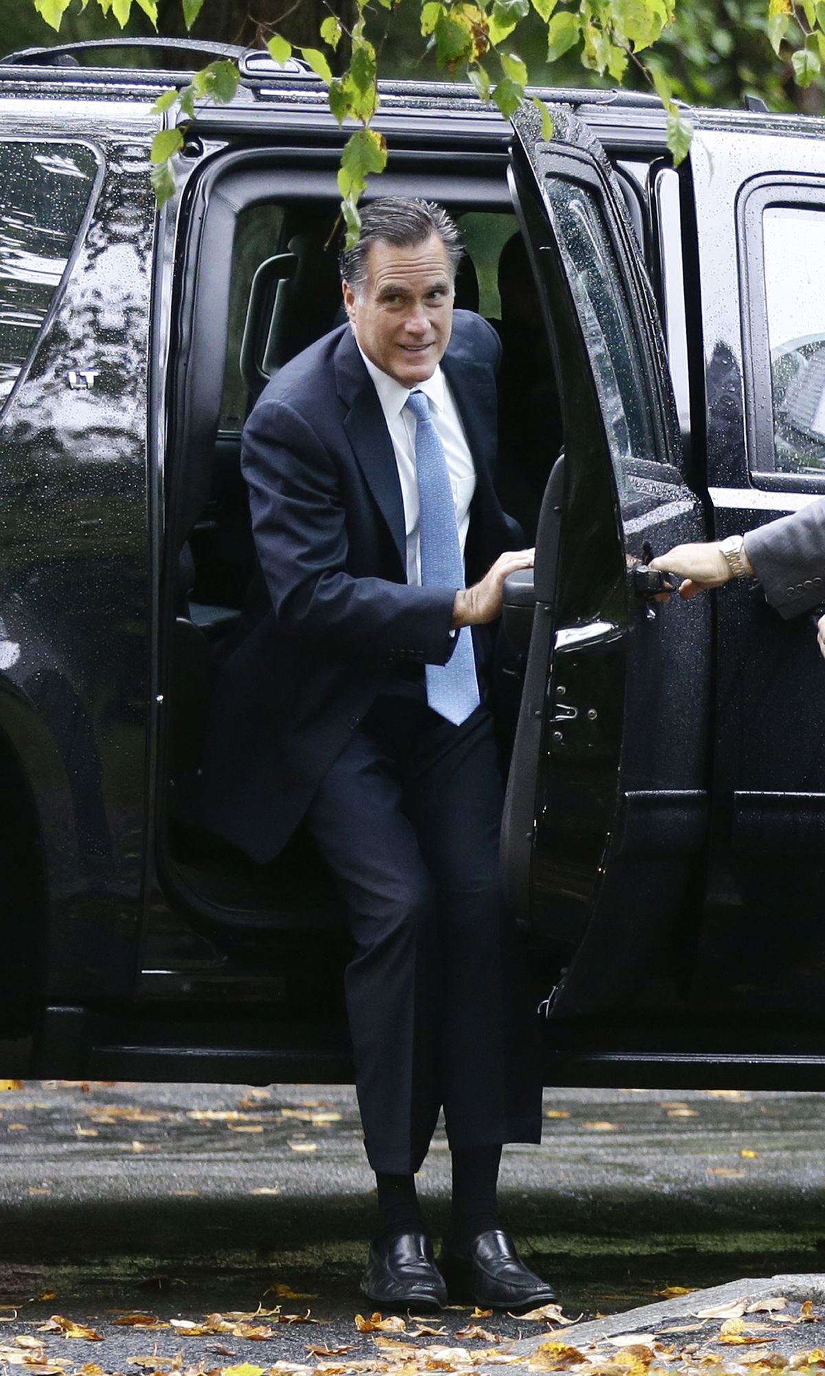 Republican presidential candidate and former Massachusetts Gov. Mitt Romney arrives for services at the Church of Jesus Christ of Latter-day Saints, in Belmont, Mass., Sunday, Sept. 30, 2012. (Charles Dharapak / Associated Press)