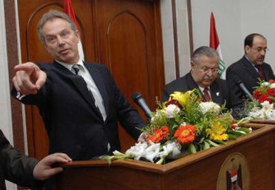 
From left, British Prime Minister Tony Blair takes a question Saturday at a news conference  with Iraq's President Jalal Talabani and Prime Minister  Nouri al-Maliki in Baghdad. 
 (Associated Press / The Spokesman-Review)