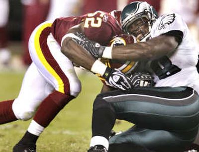 
Rocky McIntosh, left, and the Redskins made things tough for Brian Westbrook and the Eagles on Monday night.Associated Press
 (Associated Press / The Spokesman-Review)