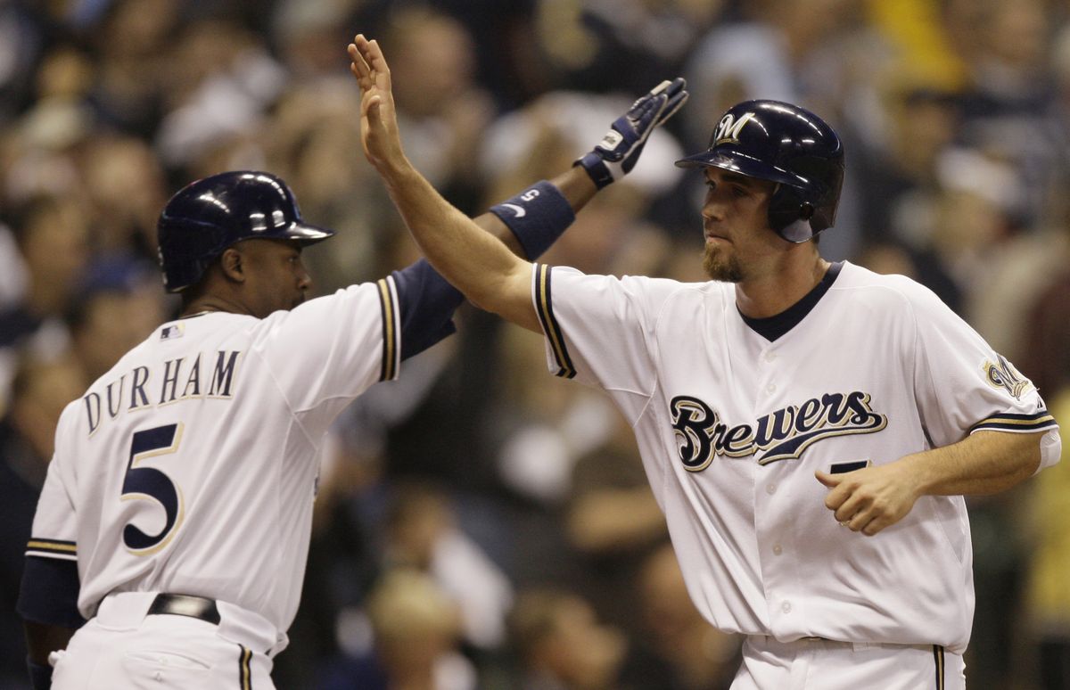 Milwaukee’s Ray Durham congratulates J.J. Hardy after scoring on Jason Kendall’s seventh-inning hit.  (Associated Press / The Spokesman-Review)