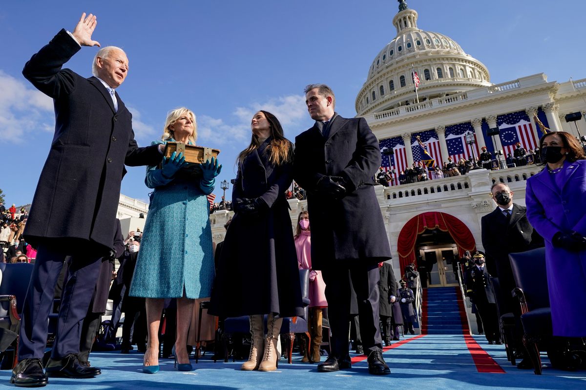 FILE - Joe Biden is sworn in as the 46th president of the United States by Chief Justice John Roberts as Jill Biden holds the Bible during the 59th Presidential Inauguration at the U.S. Capitol in Washington, on Jan. 20, 2021, as their children Ashley and Hunter watch. (Andrew Harnik)