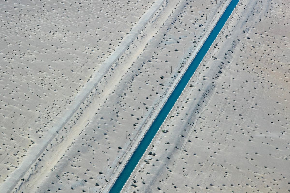 The Coachella Canal is a 122-mile aqueduct that conveys Colorado River water for irrigation northwest from the All-American Canal to the Coachella Valley north of the Salton Sea in Riverside County, California, on April 4, 2023. An older, unlined canal is on the left. (Brian van der Brug/Los Angeles Times/TNS) (Brian van der Brug/Los Angeles Times/TNS)