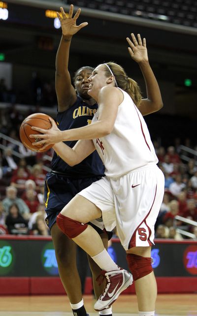 Stanford’s Kayla Pedersen, front, gets past Cal’s DeNesha Stallworth to take a shot.  (Associated Press)