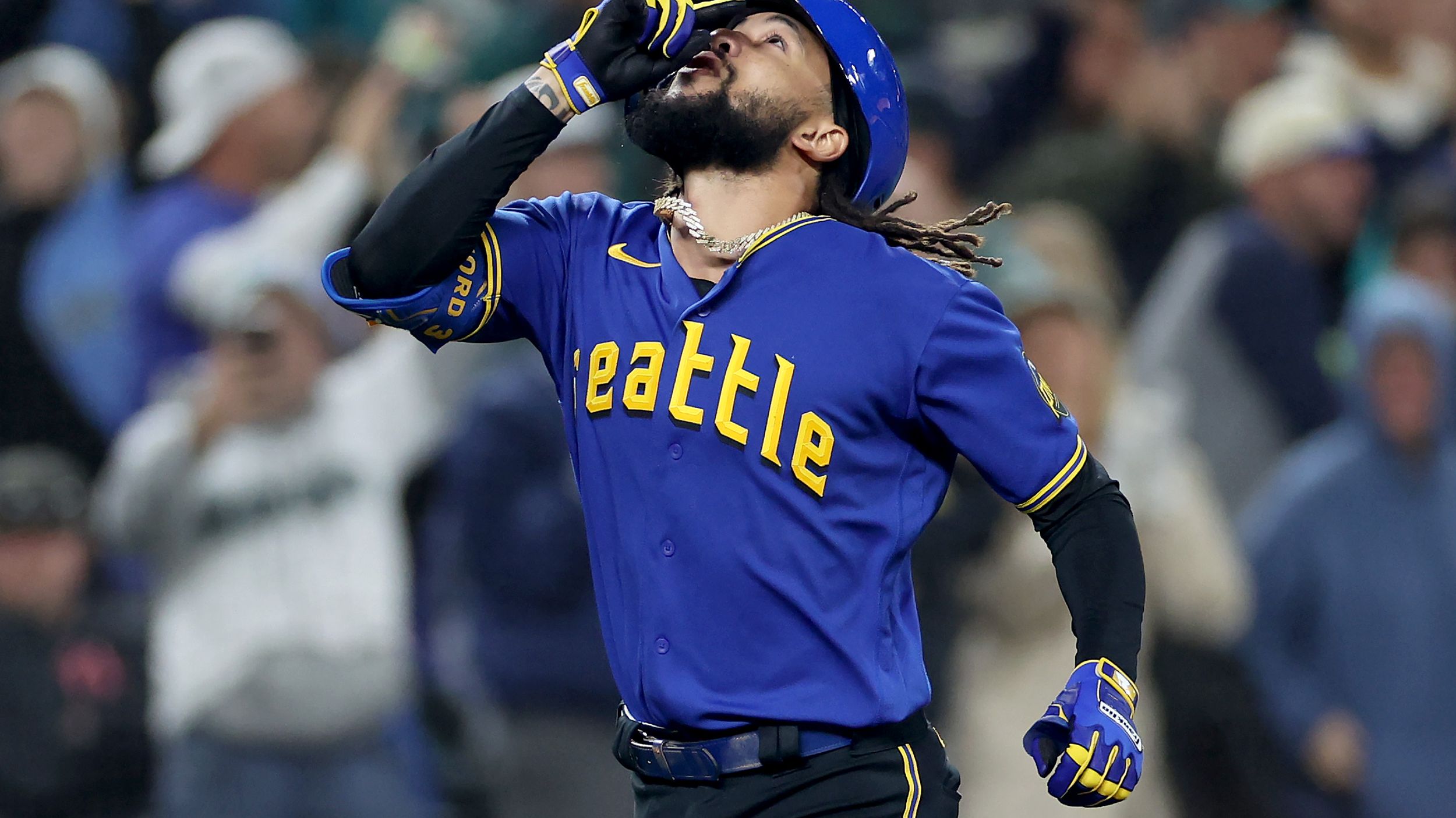 Seattle Mariners' J.P. Crawford follows through on a swing during