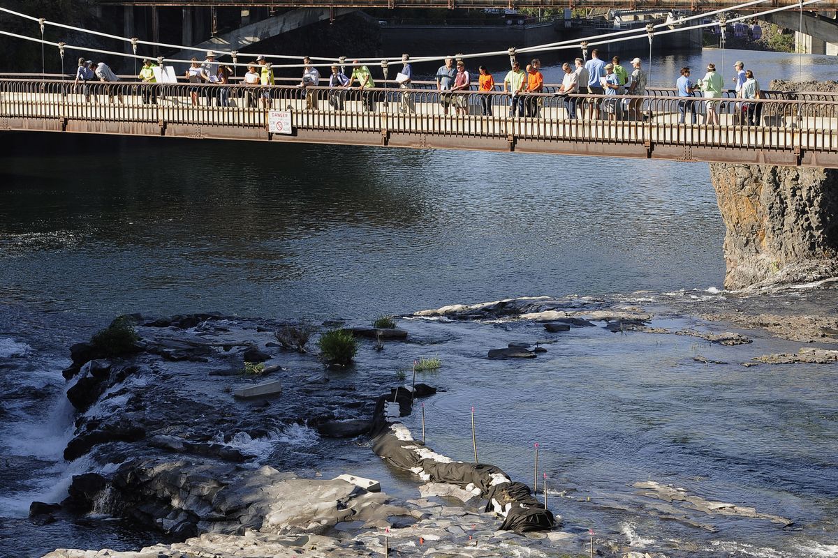 Evaluators from Avista, the Sierra Club, the Center for Environmental Law and Policy, the Department of Ecology and the city of Spokane record scores while viewing the Spokane River Falls on Wednesday, Aug. 25, 2010. (Dan Pelle / The Spokesman-Review)