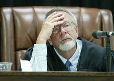 
Chelan County Superior Court Judge John Bridges listens to testimony in the trial over the 2004 Washington state gubernatorial race. 
 (Associated Press / The Spokesman-Review)