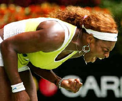 
Seventh-seeded Serena Williams of the United States reacts during her women's singles semifinal match against Russian Maria Sharapova at the Australian Open. 
 (Associated Press / The Spokesman-Review)