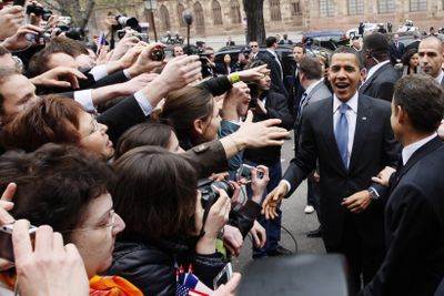 President Barack Obama  is greeted by crowds as he and first lady Michelle Obama arrive to meet France’s President Nicolas Sarkozy and wife Carla Bruni in Strasbourg, France, on Friday.  (Associated Press / The Spokesman-Review)