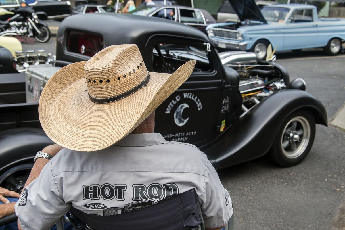Willard Stockton brought his 1937 Ford, with a Buick engine, and his extra-sized sun hat to the 2017 Garland Street Fair Car Show. The cool cars will be back this year for sure. (Dan Pelle / The Spokesman-Review)
