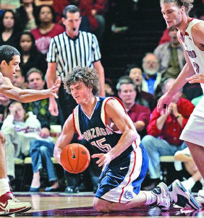 Gonzaga guard Matt Bouldin falls on the floor in front of Stanford guard Landry Fields, left, and center Robin Lopez.
(Associated Press / The Spokesman-Review)