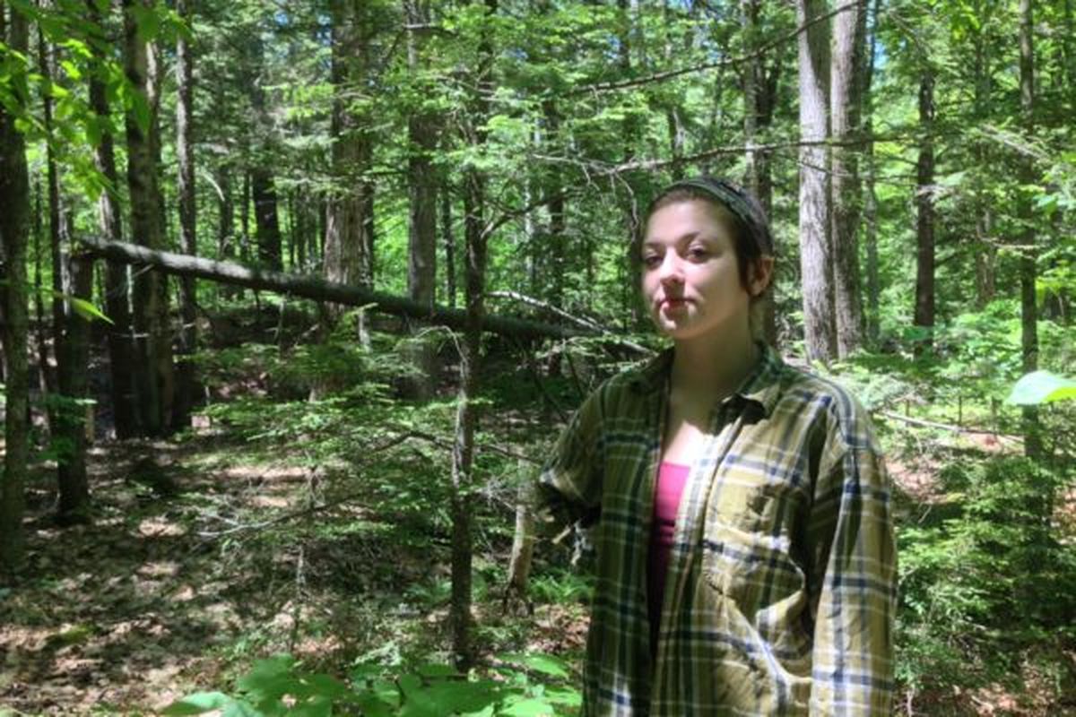 Rachel Borch, 21, was attacked while jogging in the woods near her Hope, Maine, home by a rabid raccoon. She said she had to drown the animal in self defense. (Alex Acquisto / Bangor Daily News via AP)