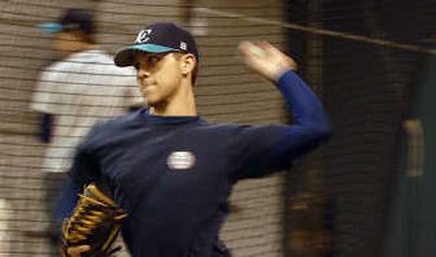 
Lake City High School senior returning varsity player Kellen Huffman pitches a ball during practice at the high school in Coeur d'Alene on Tuesday. 
 (Kathy Plonka / The Spokesman-Review)