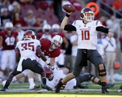 Jeff Tuel weathered pressure for a career passing day at Stanford. (Associated Press)