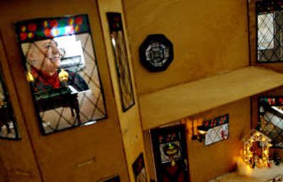 
Bea Johannessen with one of her unfinshed doll houses at her home in Coeur d'Alene. Her hobby is restoring period dollhouses. 
 (Kathy Plonka / The Spokesman-Review)