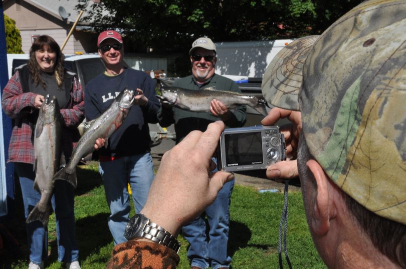 Salmon anglers pose with their spring chinook at The Guide Shop in Orofino, Idaho, last Sunday after returning from a Clearwater River fishing trip.