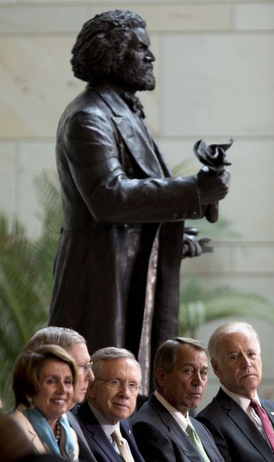 From left, Nancy Pelosi, Mitch McConnell, Harry Reid, John Boehner and Joe Biden attend a dedication of the statue of Frederick Douglass on Wednesday. (Associated Press)