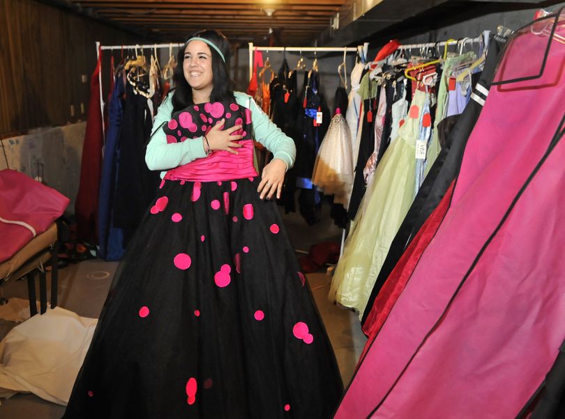 Shadle Park High School student Erin Fiorillo shows off one of the many prom dresses she has collected for her senior project. (Dan Pelle)