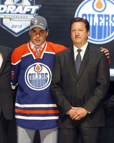 Edmonton Oilers general manager Steve Tambellini, right, stands with Nail Yakupov, the No. 1 overall pick during Friday’s NHL draft. (Associated Press)