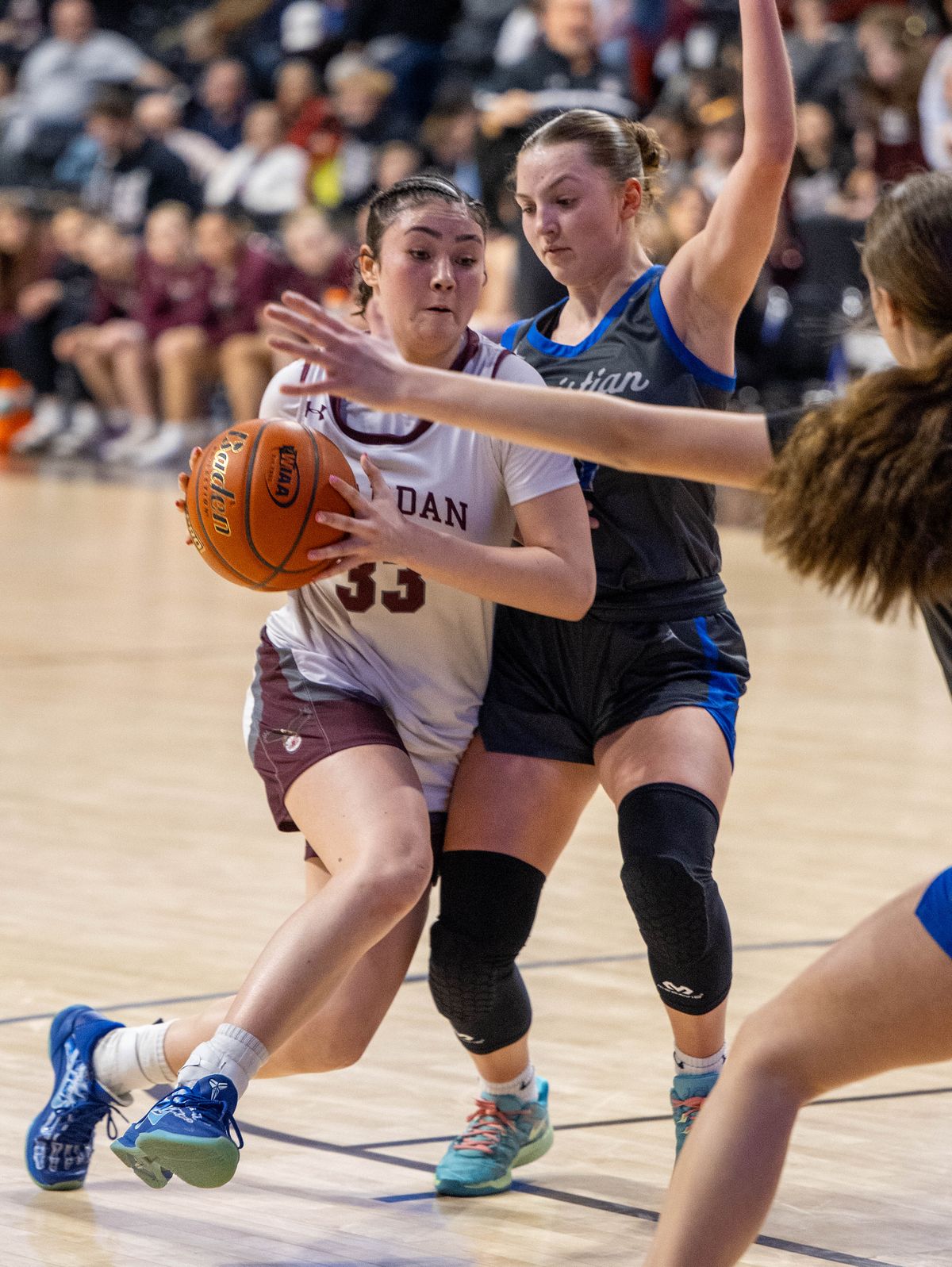 Reardan guard Chasyn Waters (33) drives the ball to the basket as Mt. Vernon Christian guard Avery McCullough (11) defends during the 2B State quarterfinal being held at the Spokane Arena, Thursday, March 6, 2025. (COLIN MULVANY)