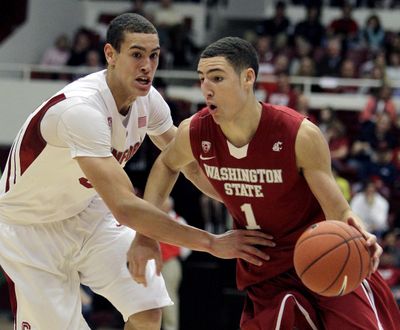 Washington State's Klay Thompson, right, drives the ball against Stanford's Dwight Powell during the first half of an NCAA college basketball game, Saturday, Jan. 15, 2011, in Stanford, Calif. (Ben Margot / AP)