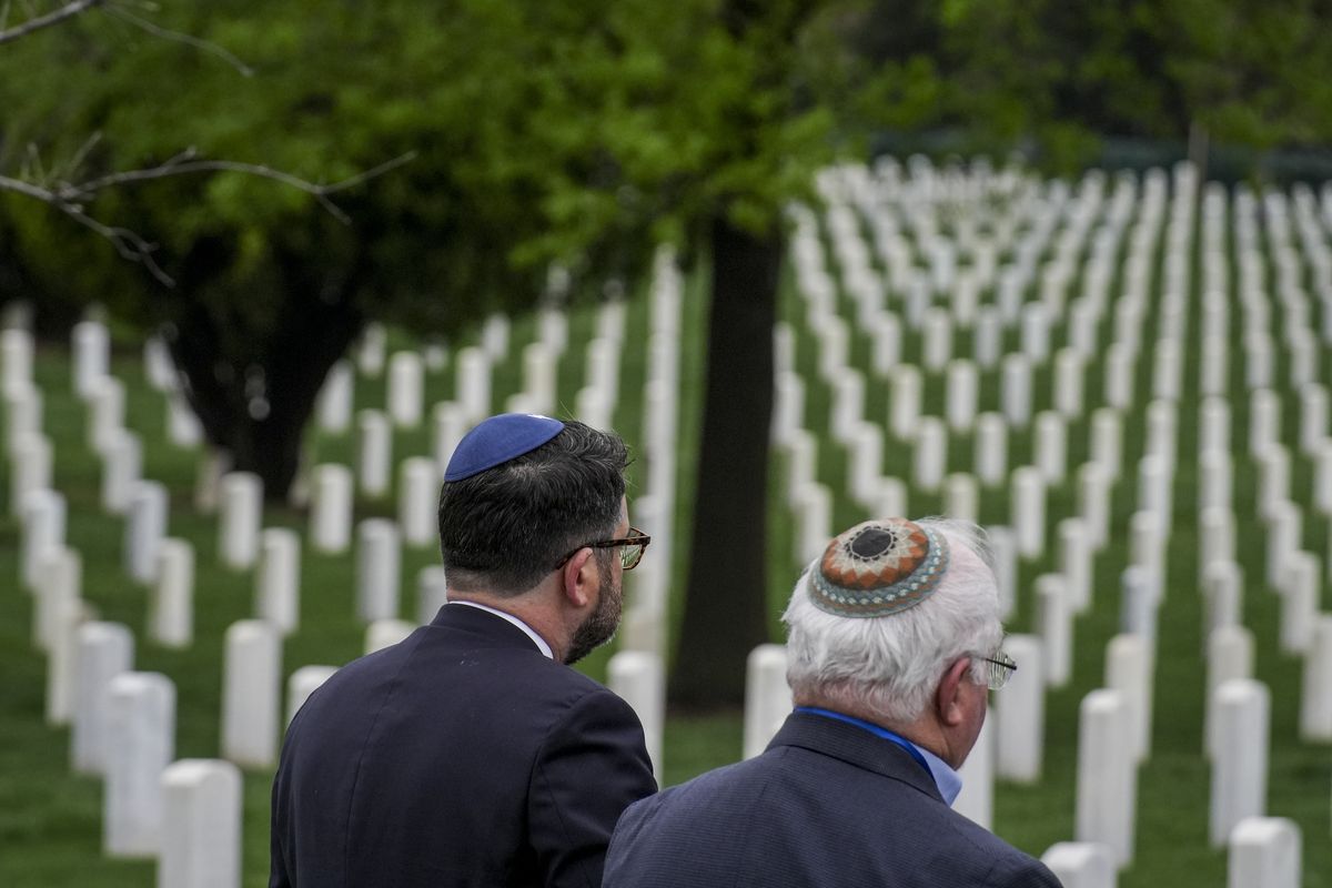 Two Jewish World War I veterans, Pvt. David Moser and Pfc. Adolph Hanf, were buried under tombstones with Christian crosses until now. The new tombstones with the Star of David were unveiled in a ceremony on Monday at Arlington National Cemetery in Washington, D.C.  (Jahi Chikwendiu/The Washington Post)