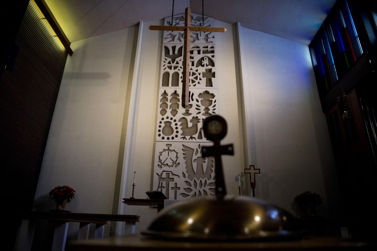 Christian symbolism is seen in the cast concrete sculpture behind the altar at Messiah Lutheran Church. (Tyler Tjomsland / The Spokesman-Review)