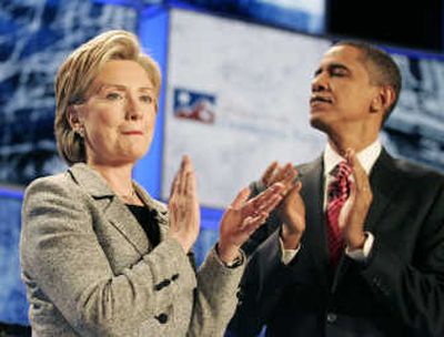 
Sens. Hillary Rodham Clinton and Barack Obama applaud at the start of the Democratic debate Thursday in Las Vegas. Associated Press
 (Associated Press / The Spokesman-Review)