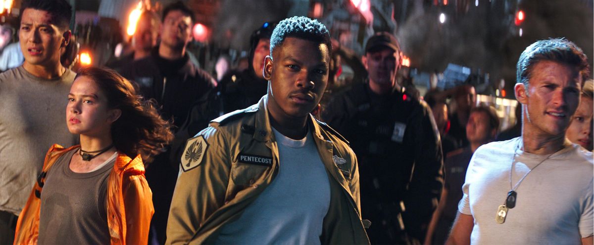 Cailee Spaeny, John Boyega and Scott Eastwood in a scene from “Pacific Rim Uprising.” (Legendary Pictures/Universal Pictures via AP) ORG XMIT: NYET601 (Legendary Pictures / Universal Pictures)